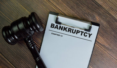 A visual representation of the bankruptcy filing process, highlighting legal documents and financial implications.